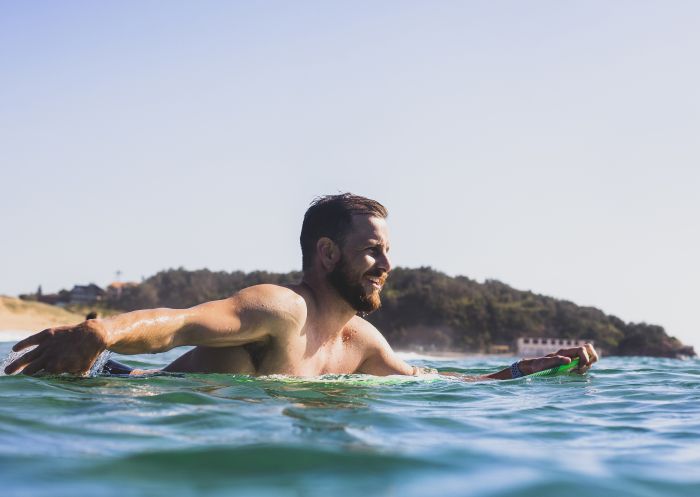 Man enjoying the surf at North Narrabeen Beach, Narrabeen