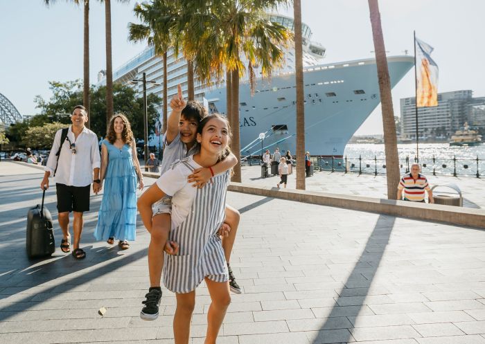 Family in front of cruise ship at Overseas Passenger Terminal, Circular Quay