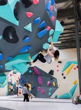  Climber on an overhung wall at BlocHaus Bouldering, Marrickville