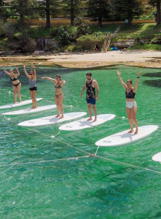 Yoga on stand-up paddle boards with Flow mOcean in Manly, Sydney North