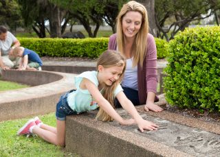 Family enjoying Hands of Fame Park at Australian Country Music Hall of Fame, Tamworth