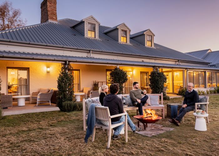 View of a group around a firepit at Spicers Guesthouse, Hunter Valley