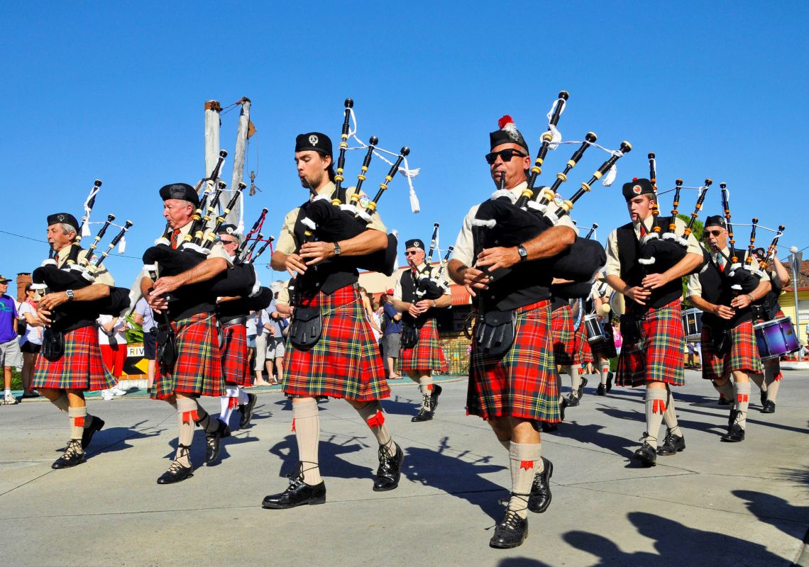 Bagpipers in kilts parade at the Highland Gathering festival in Maclean, Clarence Valley