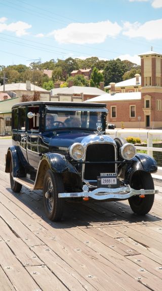 Car driving by the Court House Museum, Carcoar