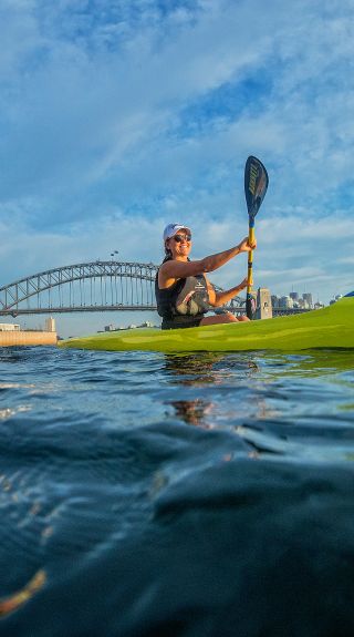 Kayakers enjoying Sydney harbour near the Sydney Opera House with the Sydney Harbour Bridge in the background, Sydney Harbour