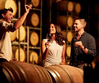 Couple enjoying wine tasting at Brokenwood Wines, Pokolbin