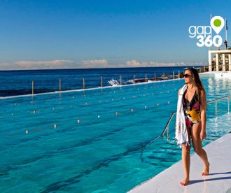 Woman enjoying the sunshine at Bondi Icebergs, Bondi