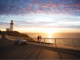 A couple enjoying sunrise at the Cape Byron Bay Lighthouse in Byron Bay Cape Byron Bay Lighthouse
