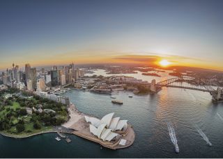 Sydney Harbour aerial at sunset with views of Royal Botanic Garden Sydney Harbour