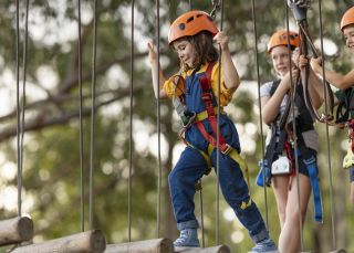 Young girl enjoying the action at TreeTops Adventure Park in Abbotsbury, Sydney West