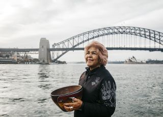 Margret Campbell performing a smoking ceremony at Blues Point Reserve, Blues Point in Sydney as part of the Dreamtime Southern X experience