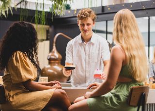 Friends enjoying cocktails, Seadrift Distillery, Brookvale