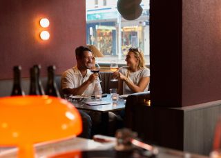 Couple drinking in the booth, Oxford House, Paddington - Credit: Steven Woodburn