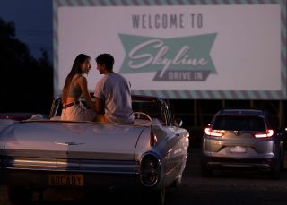Couple sitting in their car ready to watch a movie at the Skyline Drive, Blacktown