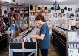 Man browsing through records, Repressed Records, Newtown