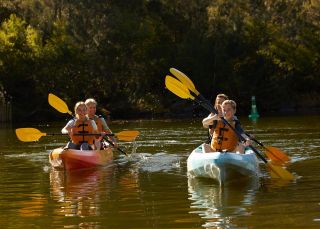 Family enjoying a day of kayaking on the Nepean River, Penrith