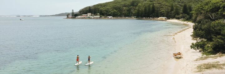 Paddle boarders at Shoal Bay in Port Stephens, North Coast