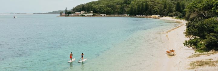Paddle boarders at Shoal Bay, Port Stephens