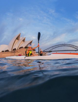 Women kayaking on Sydney Harbour in summer