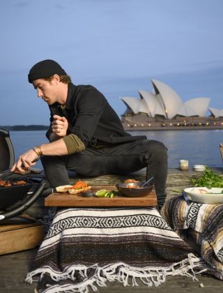 Hayden Quinn cooking with Opera House in background, Sydney Harbour