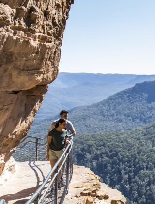 Couple enjoying a walk along the Wentworth Falls Track, Blue Mountains National Park
