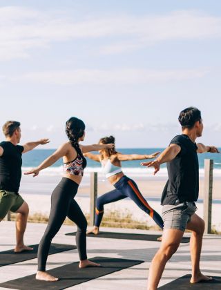 Elements of Byron guests enjoying morning beachfront yoga sessions, Byron Bay