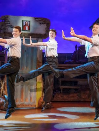 Book of Mormon cast performing on stage