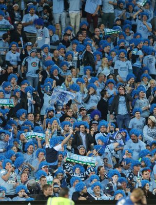 Crowd of NSW blues fans cheering in the stadium