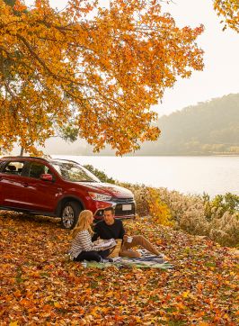 Couple enjoying a romantic picnic by Hawkesbury River, Wisemans Ferry