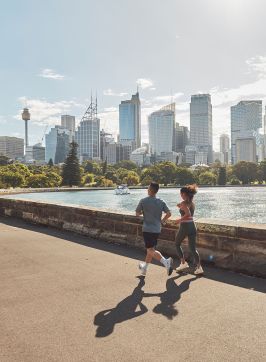 Couple running through the Royal Botanic Gardens, Sydney