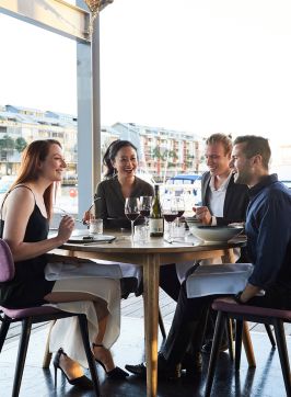 Friends enjoying food and drink waterside, LuMi Bar & Dining, Pyrmont 