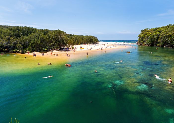 Bathers swimming in calm lagoon by Wattamolla beach, Royal National Park