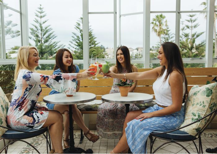 Friends enjoying afternoon drinks at Coogee Pavilion in Coogee