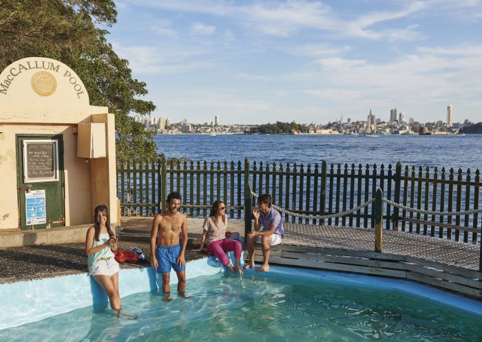 Students relaxing beside Maccallum Pool in Cremorne Point