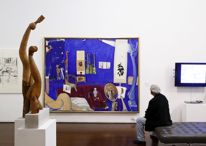 A man admiring artworks at Brett Whiteley Studio in Surry Hills, Sydney