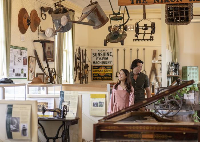 Couple learning about the cultural and heritage background of Camden at the Camden Museum in Camden, Sydney West