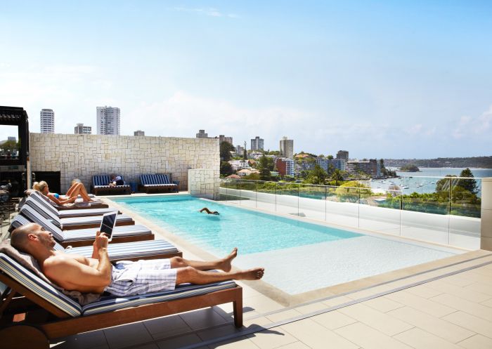 Guests relaxing by the rooftop pool at the Intercontinental Hotel in Double Bay, Sydney East