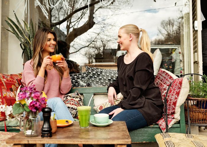 Friends catching up for coffee and juice at Kawa in Surry Hills