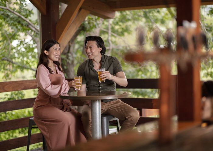 Couple enjoying a beer at George IV Inn in Picton, Sydney west