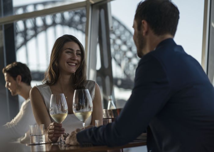 Couple enjoying food and drink at Quay Restaurant, The Rocks