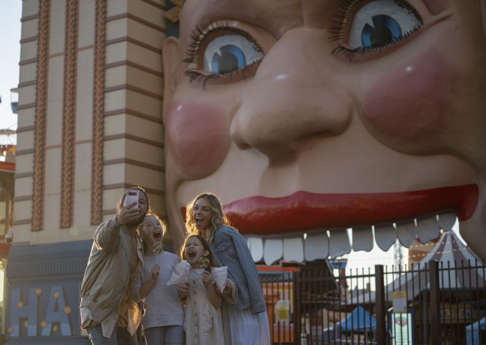 Family taking a selfie outside Luna Park Sydney, Milsons Point, Sydney North