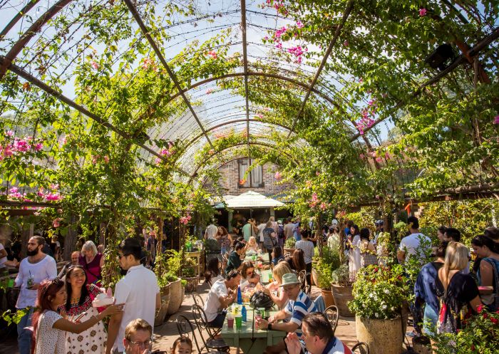 People dining in The Garden - located at The Grounds of Alexandria, Alexandria