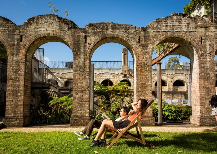 Couple relaxing in the heritage-listed Paddington Reservoir Gardens in Paddington, Sydney