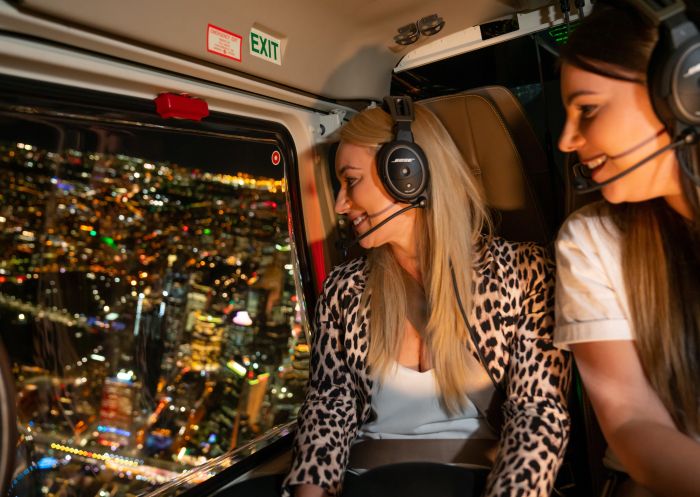 Passengers enjoying an aerial tour of Vivid Sydney 2019 with Sydney HeliTours.