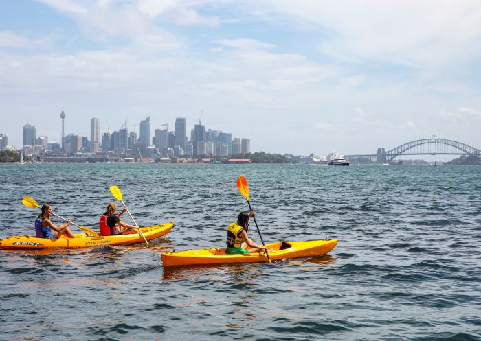 Friends enjoying a day of kayaking on Sydney Harbour