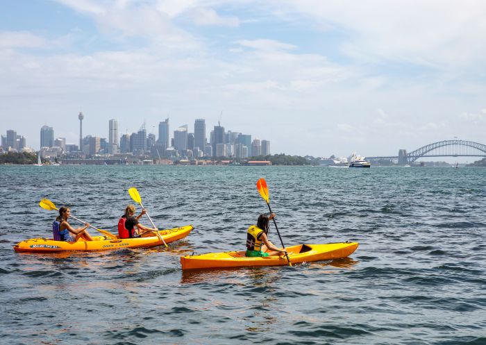 Friends enjoying a day of kayaking on Sydney Harbour