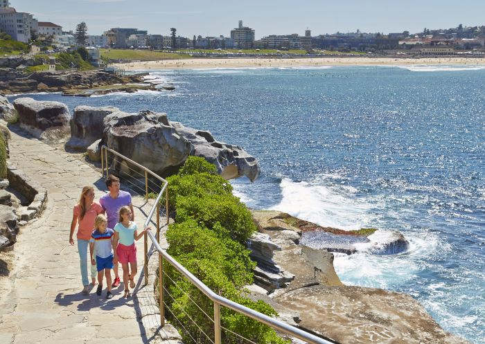 A family enjoy the Bondi to Bronte Walk in Sydney