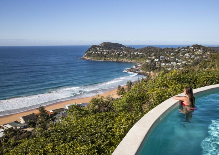 Woman enjoying ocean views from Jonah's on Whale Beach