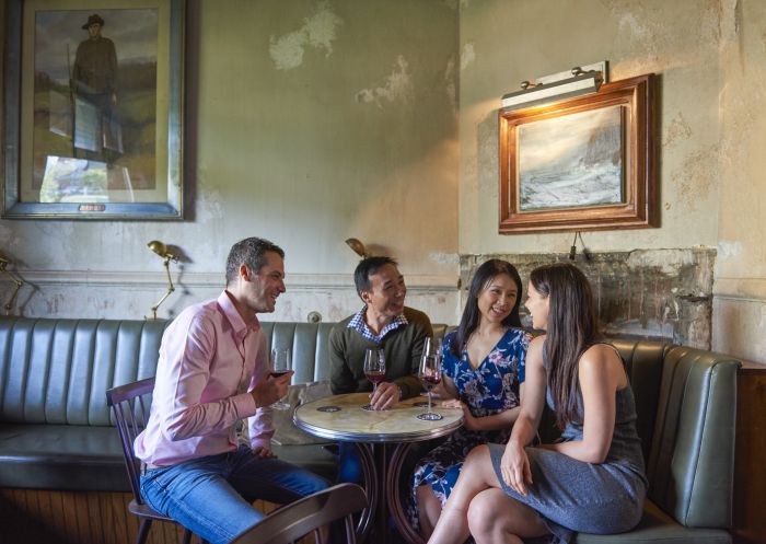 Couples enjoying a glass of wine at the Public House in Hotel Palisade, Millers Point, Sydney City