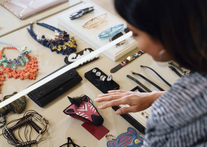 Woman browsing designer labels at the Parlour X fashion boutique on Oxford Street, Paddington